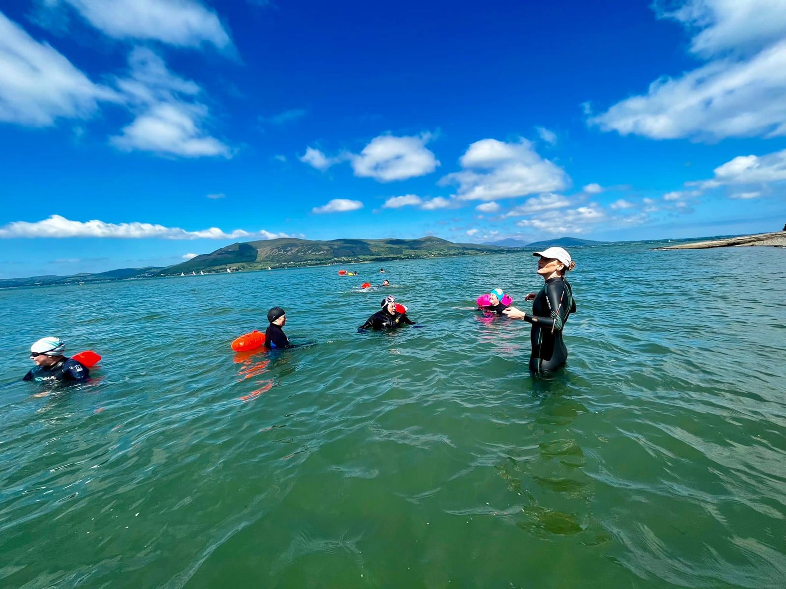 Christine coaching open water swimmers at Carlingford Lough