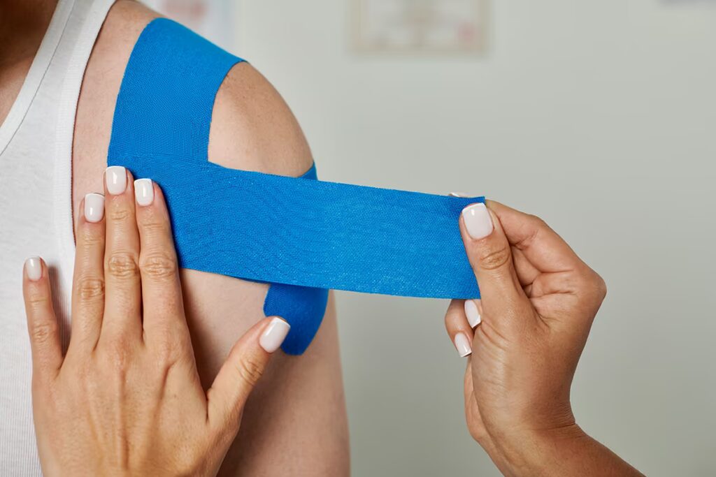 Kinesio taping applied to a client's shoulder