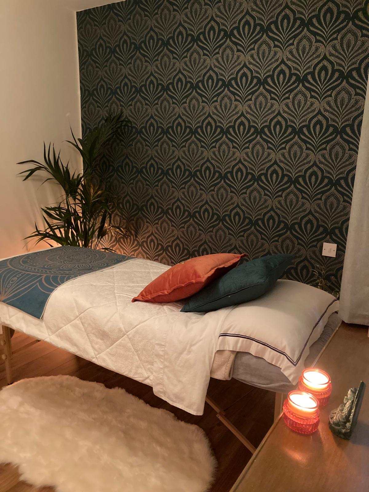 Reiki treatment room — calm, candlelit healing space